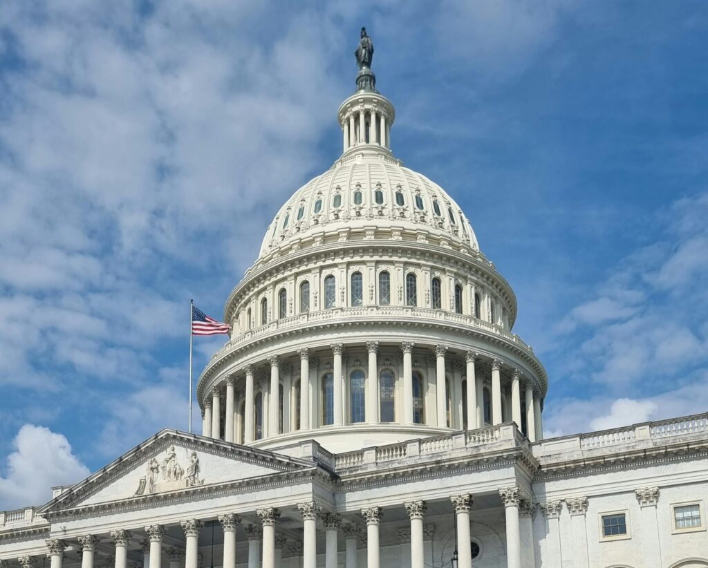 Capitol building cut out with blue sky